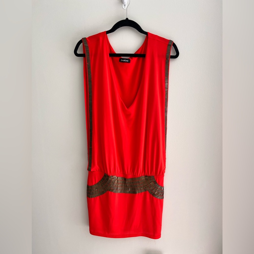 Women Bebe orange with brass metal detail mini dress